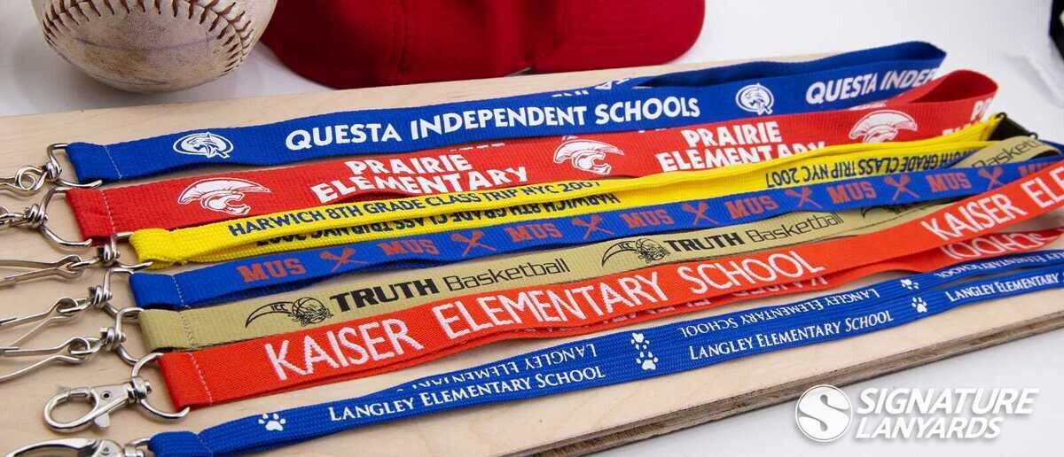 Collection of custom school spirit lanyards with colorful designs