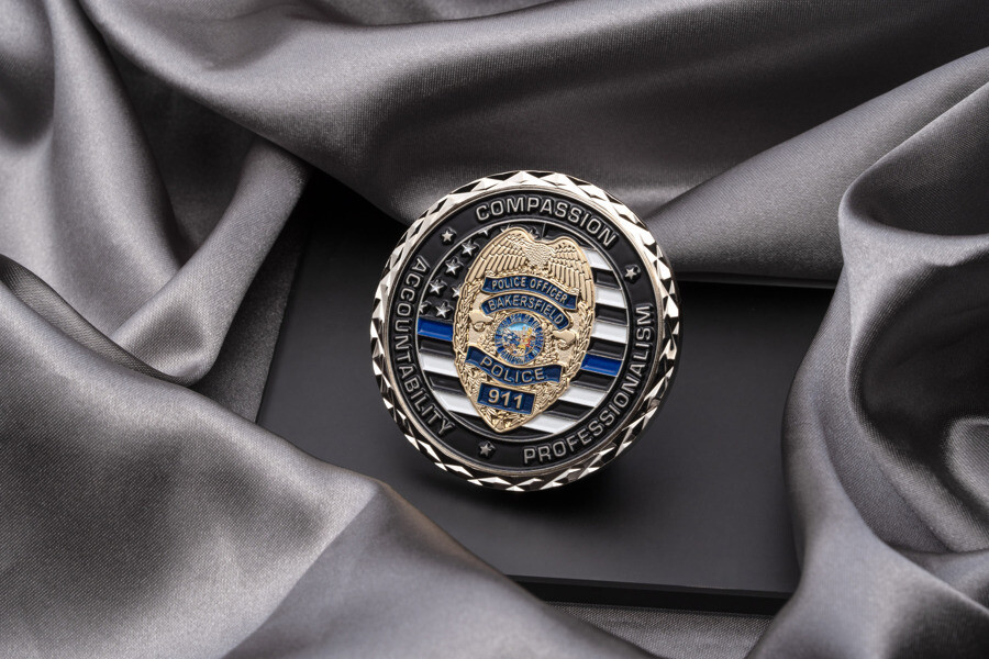 Challenge coin with a cross cut edge